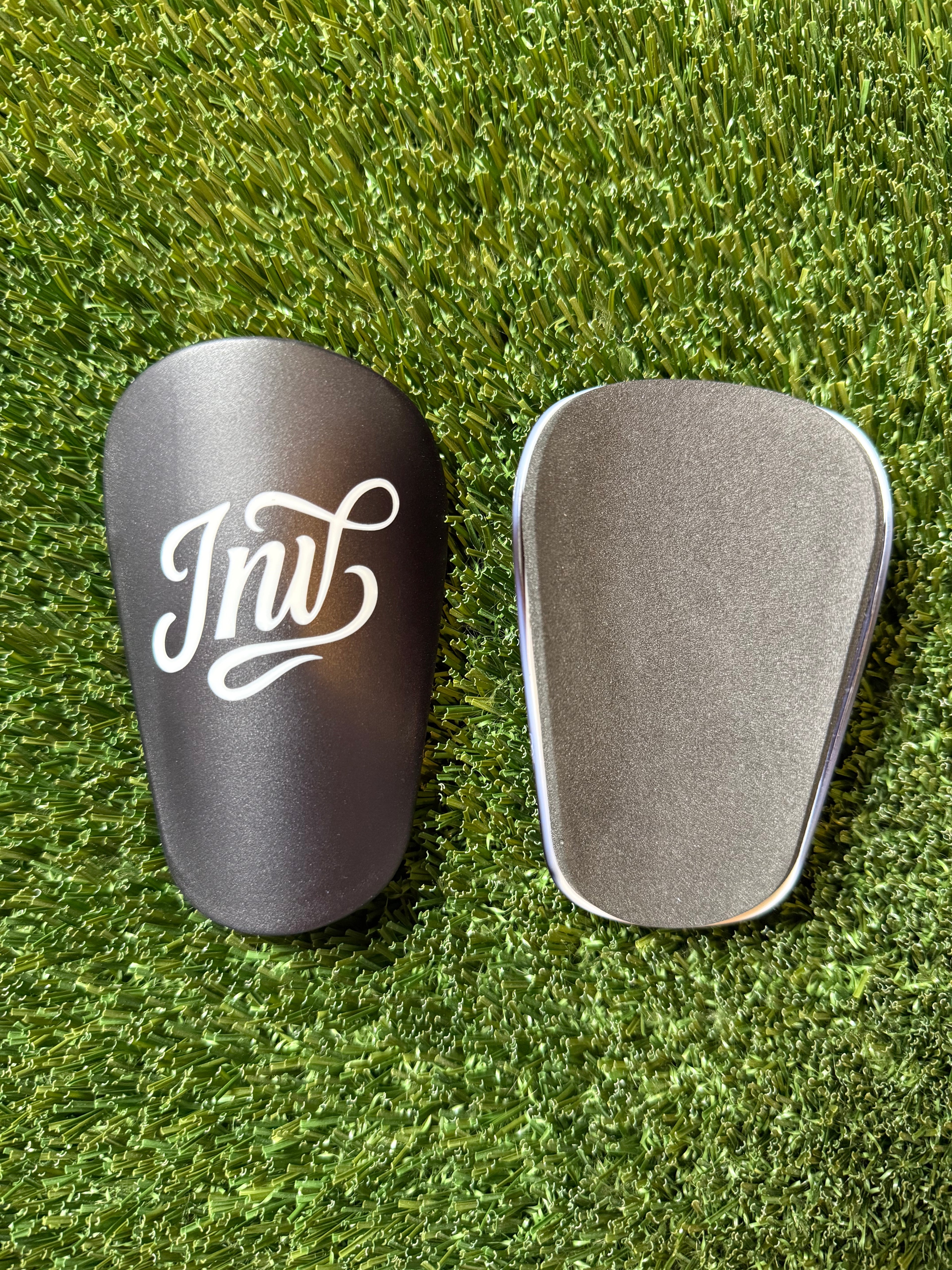Black Invictus Logo Mini Shin Guards